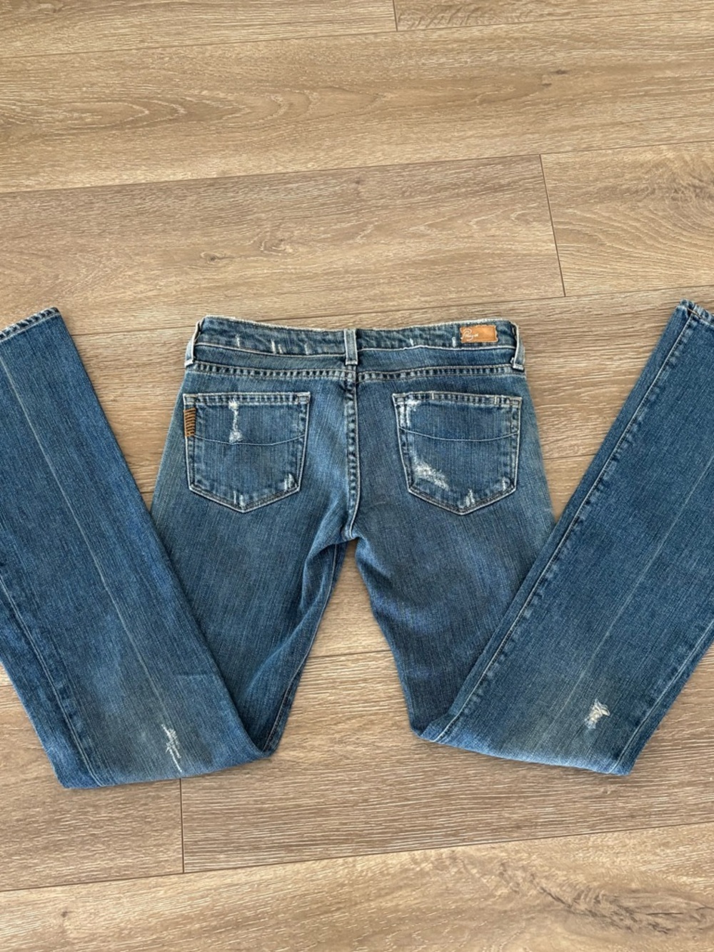 PAIGE Faded Light Blue Denim Jeans with Brown Patch